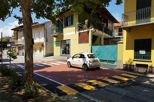 Car driving over crossing